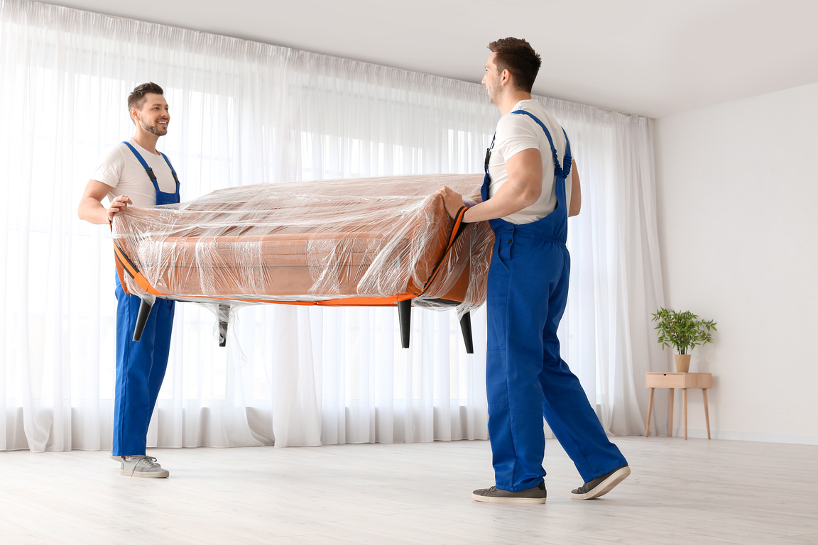 Loaders Carrying Furniture in Flat